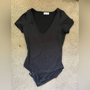 Pink lily black bodysuit.